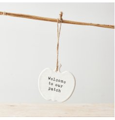A stylish ceramic pumpkin shaped sign with a cute 'Welcome to Our Patch' slogan. 
