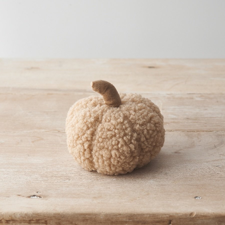 A stylish sherpa material pumpkin decoration in a natural colour scheme. 