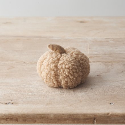 A sweet pumpkin decoration in a stylish sherpa material and neutral colour scheme. 