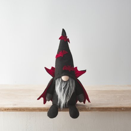 A standing Dracula gonk decoration with a stylish cape and bat decorated hat. 