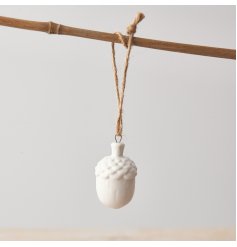 A stylish dainty acorn decoration in white. Beautifully detailed and finished with a jute string hanger. 
