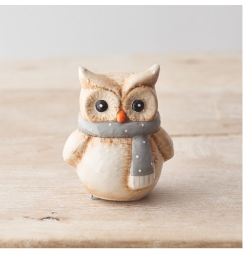 A beautifully detailed owl ornament with a polka dot scarf. 