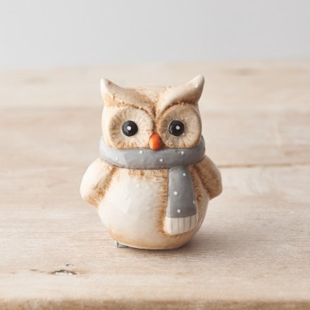 A cute owl ornament with a beautifully detailed finish and grey and white polka dot scarf. 