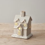 Adorn your shelves with this chic, stylish and on trend ceramic LED house. With a natural glaze and warm glow lights