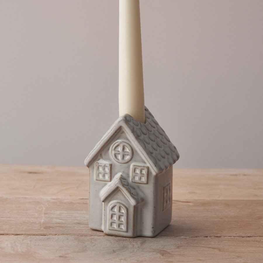 Present your classic candle sticks or advent candles in this charming ceramic house candle holder. 