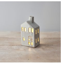 create an ambient home this season with this rustic house shaped t-light holder. 