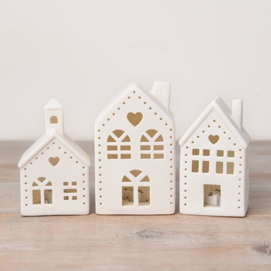 A sweet and stylish ceramic house decoration with light up design and cut out details with sweet heart feature. 