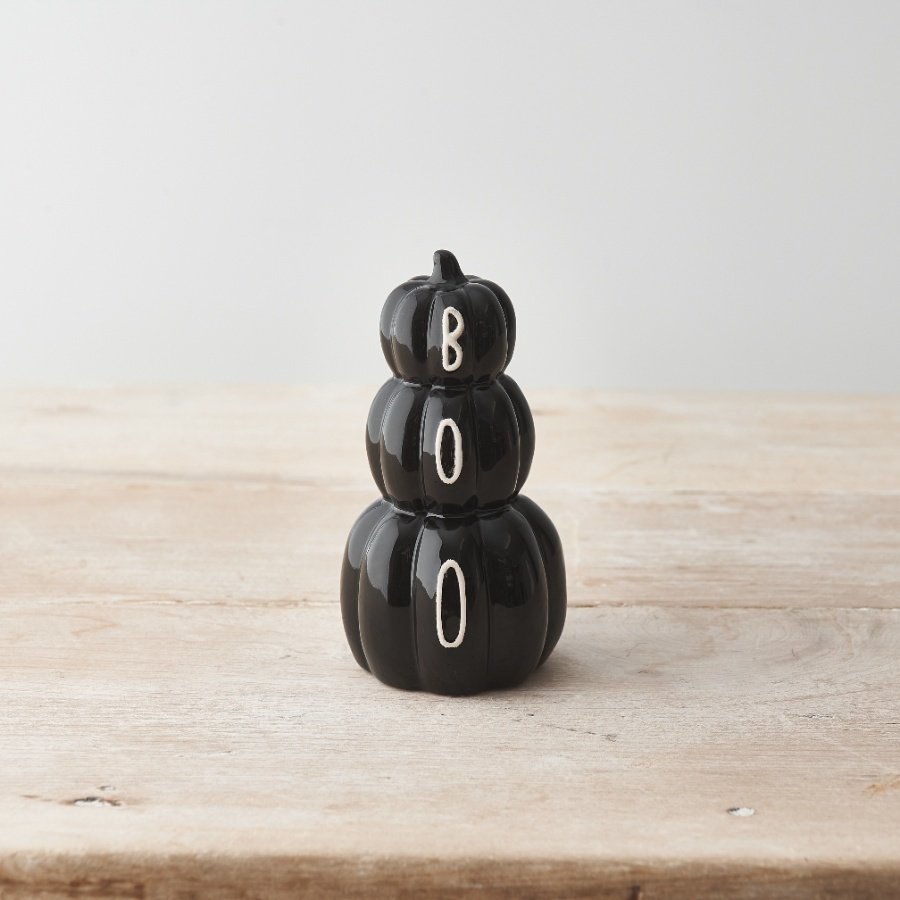 A unique pumpkin stack ornament. Beautifully glazed with a black glossy finish and BOO slogan written in white. 