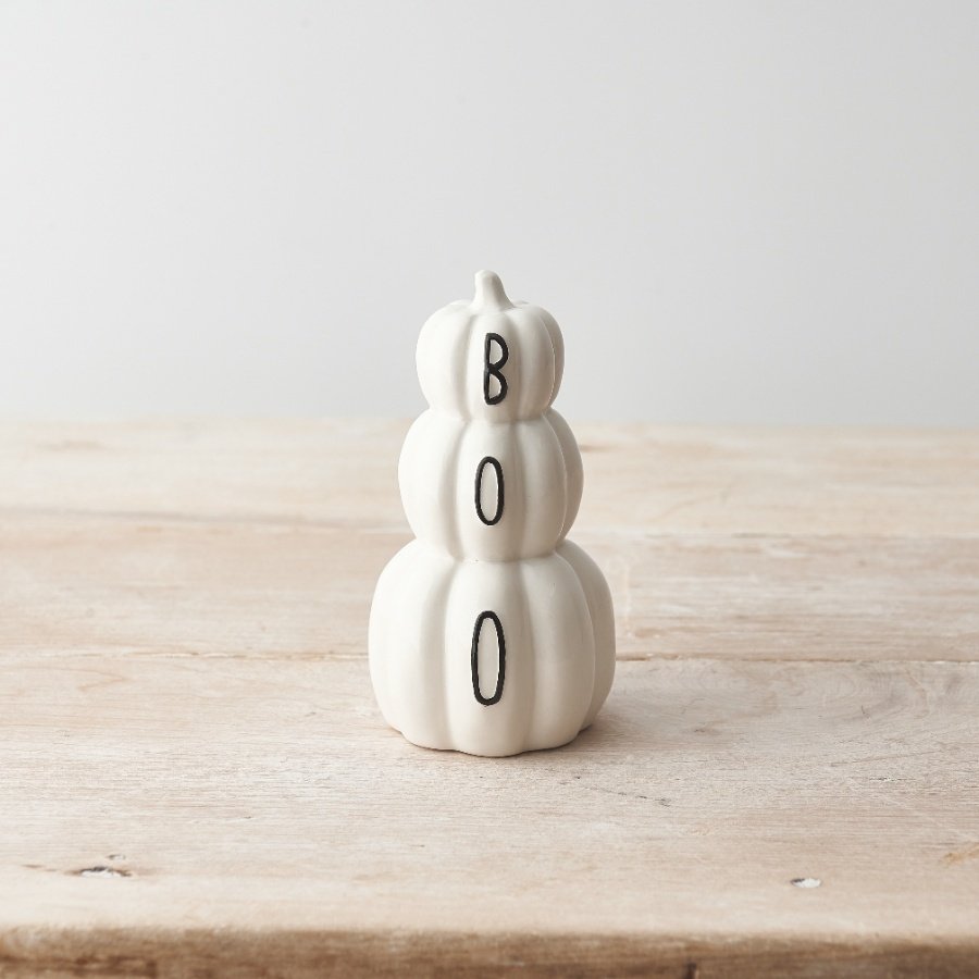 A chic and unique ceramic pumpkin stack with a black BOO slogan. 