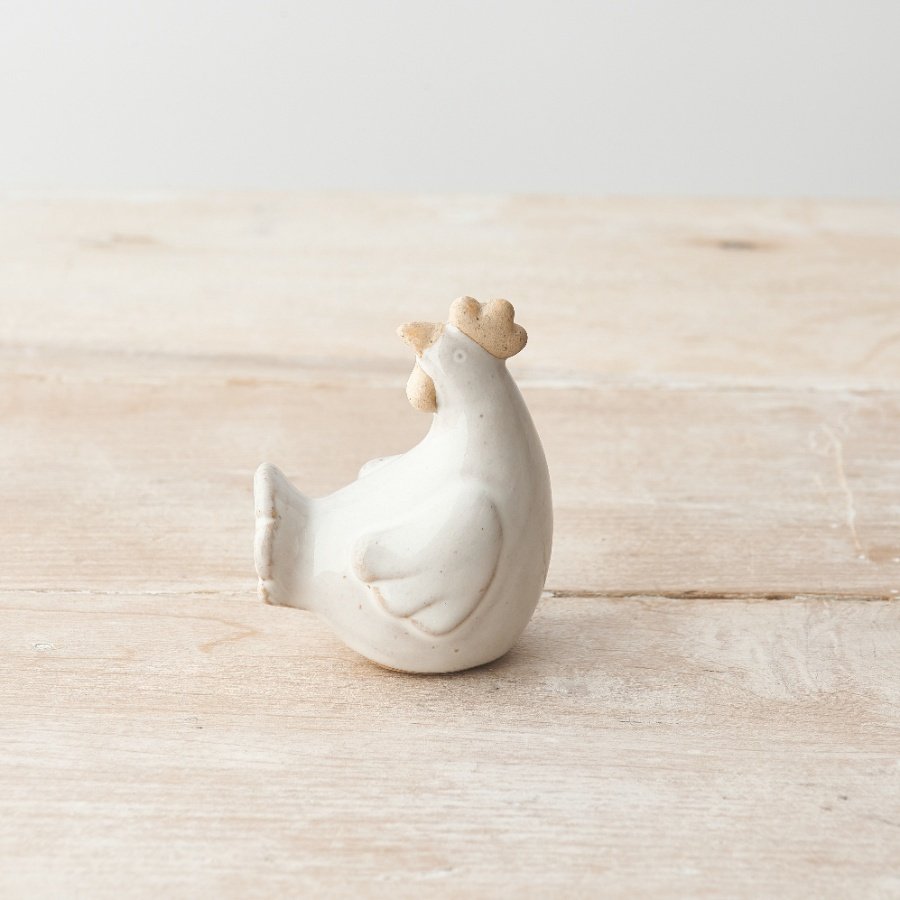 A rustic chicken ornament with a natural glaze. A must have farmhouse inspired interior accessory for the home.