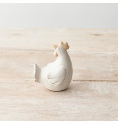 A rustic chicken ornament with raw detail and a reactive glaze.