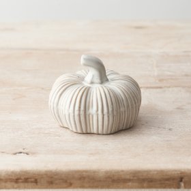 A charming ceramic pumpkin ornament with a rustic finish and rich natural glaze.