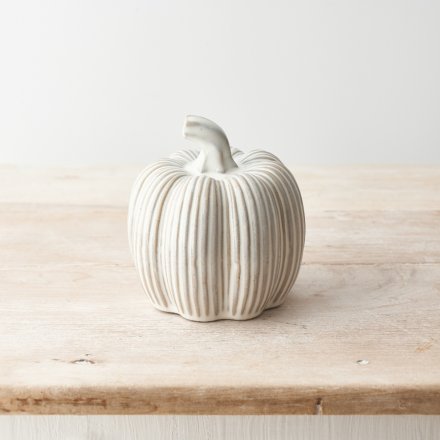 A stylish ribbed ceramic pumpkin with a natural reactive glaze.