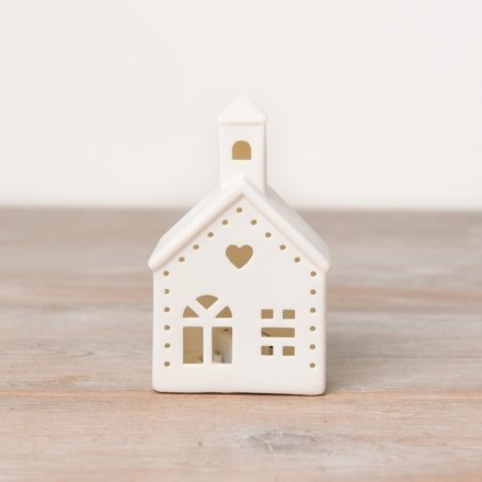 A ceramic church shaped decoration with light up feature, cut out design and sweet heart detail. 