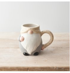 A stylish and unique ceramic gonk mug in grey and natural colours with a polka dot handle and rim. 