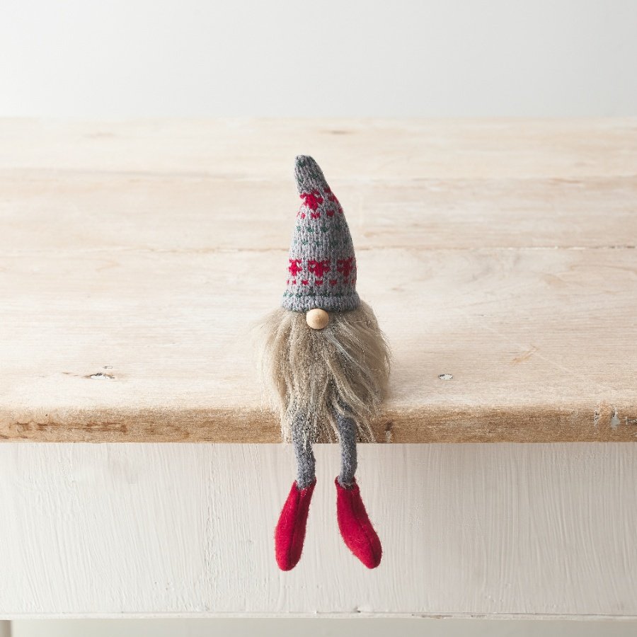 A cute fabric gonk with dangly leg design, patterned knitted hat, bead nose and fluffy beard. 