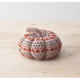 A decorative fabric pumpkin featuring a stylish patterned knit fabric design. 