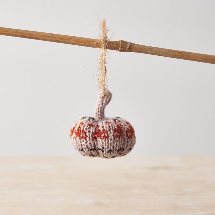 A gorgeous and unique miniature knitted pumpkin hanger in rich earthy colours including a stunning burnt orange.