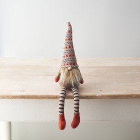 Add an adorable gnome to your Autumn home decor for a cute Halloween touch.