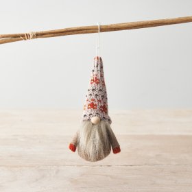 A charming gonk decoration with an autumnal burnt orange knitted hat and jumper. Complete with a small wooden nose.