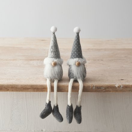 An assortment of 2 shelf sitting gonk decorations in stylish grey tones with patterned fabric and fluffy beard. 