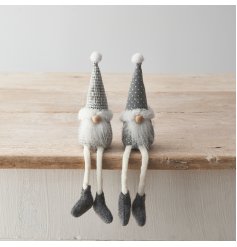 2 Assorted sitting gonk decorations featuring grey patterned fabric, fluffy beard and long dangly legs. 