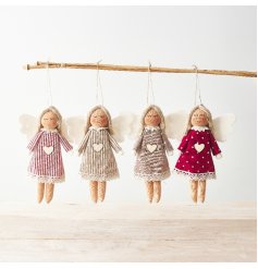 A mix of 4 hanging angel decorations in red and white strip and polka dot designs. 