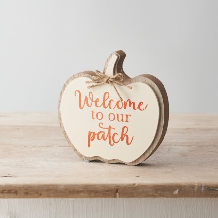 A stylish and unique wooden pumpkin sign in rich cream and orange colours. 