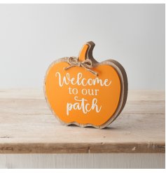 A charming and unique pumpkin shaped sign reading 'Welcome to our Patch'. 