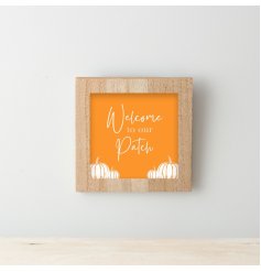 A colourful wooden framed sign with halloween themed "welcome to our patch" design with pumpkin detail. 