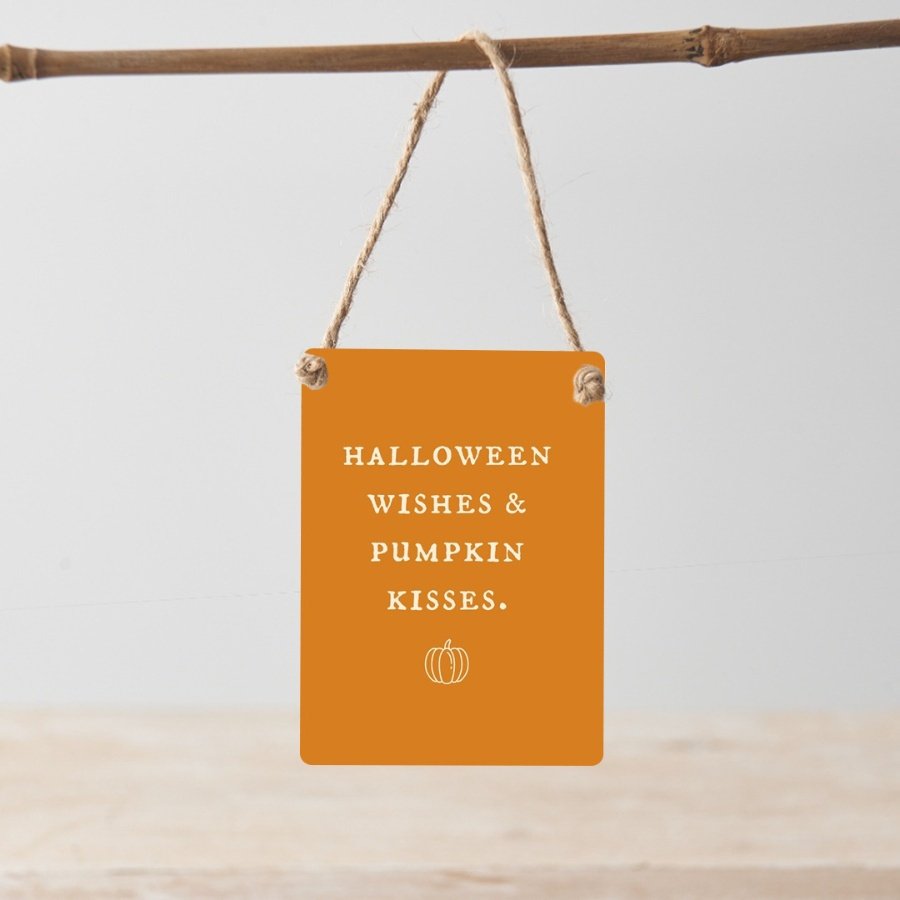 Halloween wishes and pumpkin kisses. A charming mini metal sign with jute string hanger.