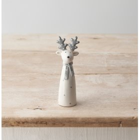 A chic ceramic reindeer ornament in festive white and grey colours. 