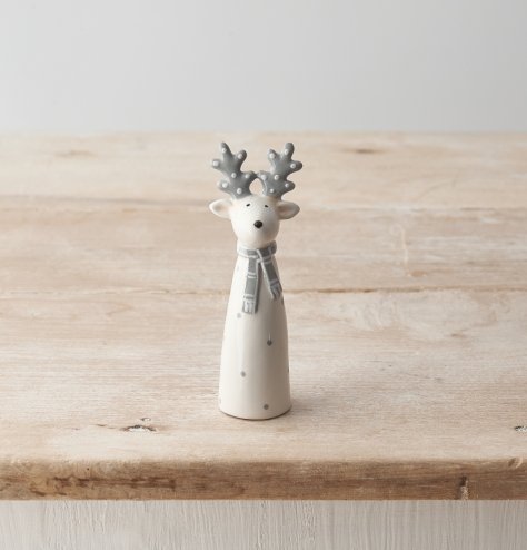 A stylish grey and white polka dot reindeer ornament with scarf detail. 