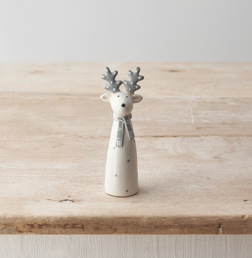 A chic ceramic reindeer ornament in festive white and grey colours. 