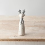 A chic ceramic reindeer ornament with grey and white polka dots.
