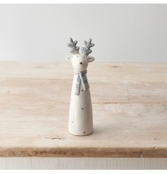 A chic ceramic reindeer ornament with grey and white polka dots.