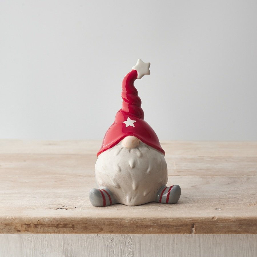 Fall in love with this adorable festive Gonk with a Christmas red hat and cute stripy legs.