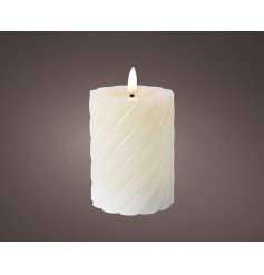 A stylish white candle with a twisted striped pattern and led flame light. 