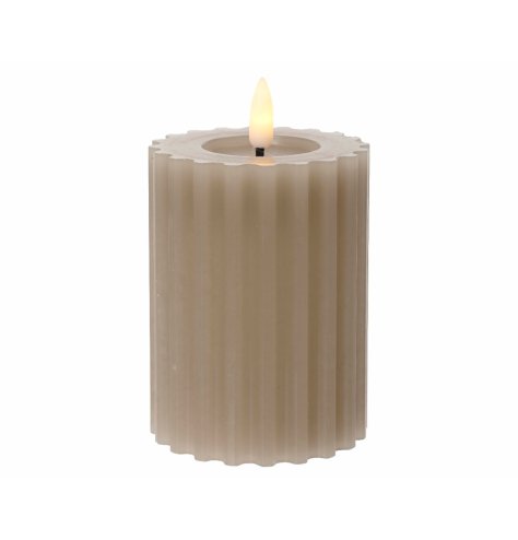 A stylish candle with a ribbed design and warm glow LED flame.