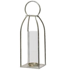 A rustic silver lantern with a contemporary rectangular design. Complete with round handle and glass candle holder.