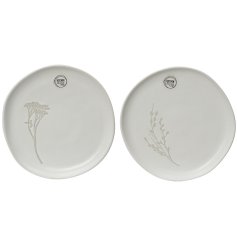 An assortment of 2 irregular round breakfast plates in flower and leaf designs.
