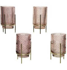An assortment of 4 chic glass t-light holders in blush and velvet pink colours. 