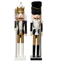 A fabulous assortment of wooden nutcracker decorations. Each is painted with gold, black and white colours. 