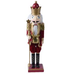 A fabulous wooden nutcracker decoration with fabric details. In luxurious gold and red colours this nutcracker 