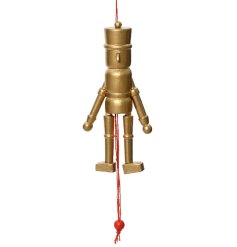 A unique golden nutcracker with a festive red hanger. 