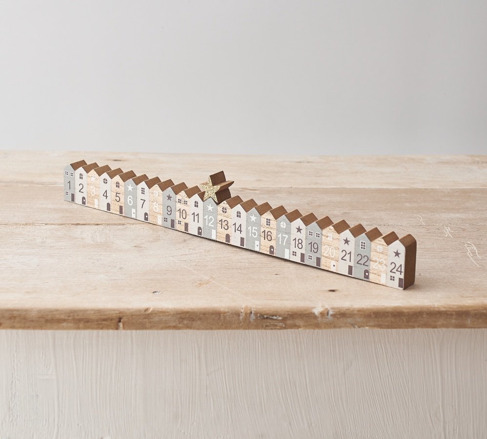 Count down the days until Christmas with this charming wooden advent calendar with star counter.