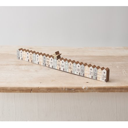 A stylish wooden advent calendar with 24 Nordic style houses and a star counter. 