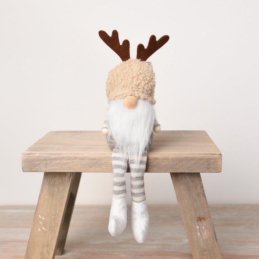 A charming and unique sitting Gonk decoration. Complete with antlers, stripy legs and a cute wooden nose.