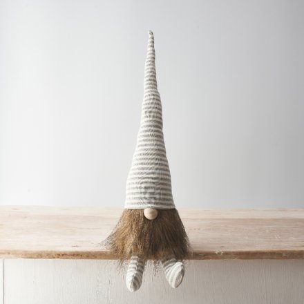 A nordic style fabric gonk decoration in grey and white candy cane stripes with a faux fur beard. 