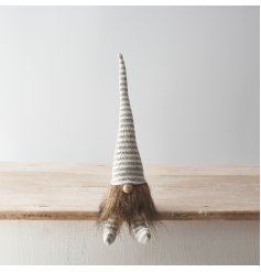 A Scandinavian inspired sitting Gonk decoration in chic grey and cream stripy colours. 